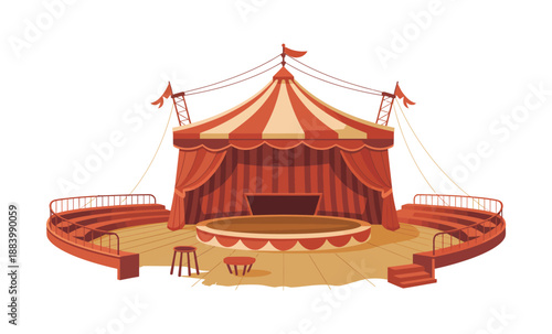 An empty red and white striped circus tent with a circular stage and seating area