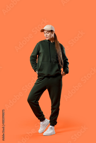 Young woman in sports suit ...