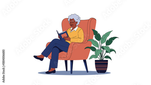 Senior woman with gray hair sitting in a comfortable armchair while reading a book and relaxing at home with a plant.