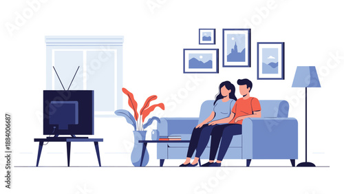Young couple sitting on a blue sofa and watching television together in a modern living room with wall pictures.