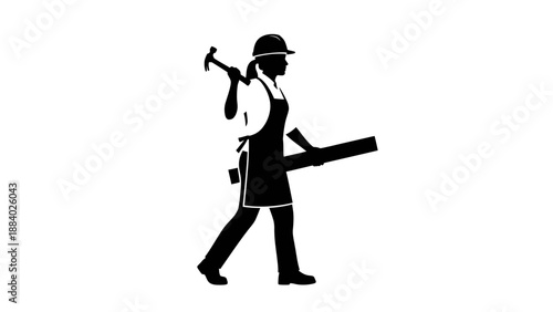 Worker carrying tools on a site.