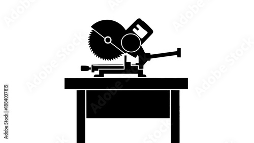 A black silhouette of a miter saw on a workbench in a workshop