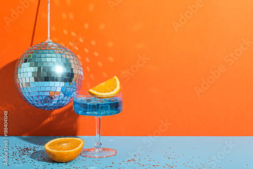 Glass with cocktail, orange...