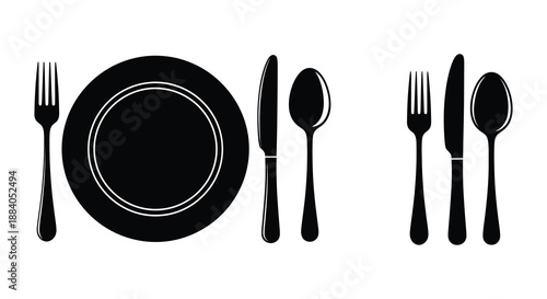 Black flatware and dinner plate arrangement minimalist dining scene in dark silhouette