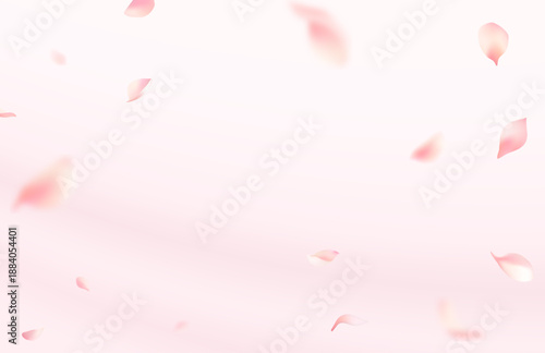 Falling pink cherry blossom petals on soft gradient background with copy space

