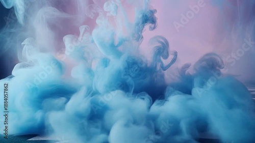 Vibrant blue ink explosion in water, creating a colorful, swirling pattern, against a pink background