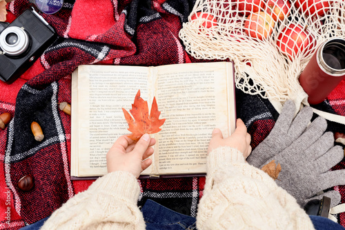Woman with autumn leaf read...