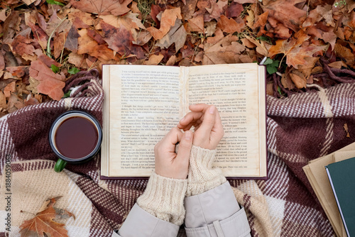Female hands with book and ...