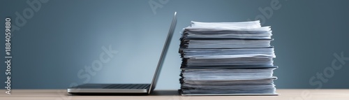 Wallpaper Mural Laptop and Stack of Paperwork Symbolizing Digital Transformation and Office Organization Torontodigital.ca