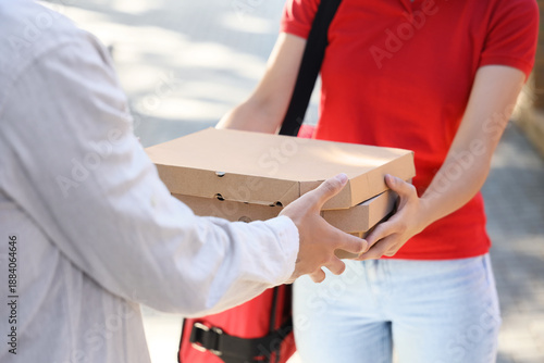 Female courier delivering p...