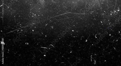 Gritty black and white film grain texture with scratches and dust particles for vintage cinematic overlay effects