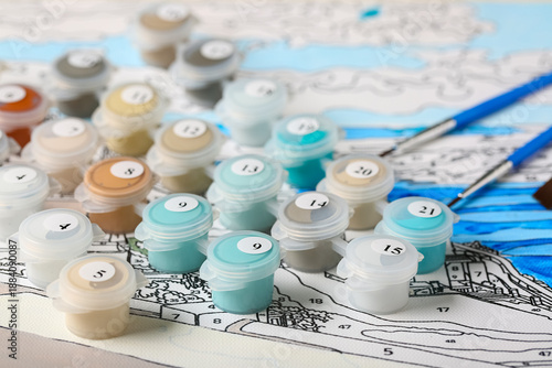 Set of cans with paints on ...