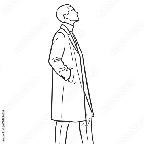 Man wearing a stylish trench coat and trousers looking up.