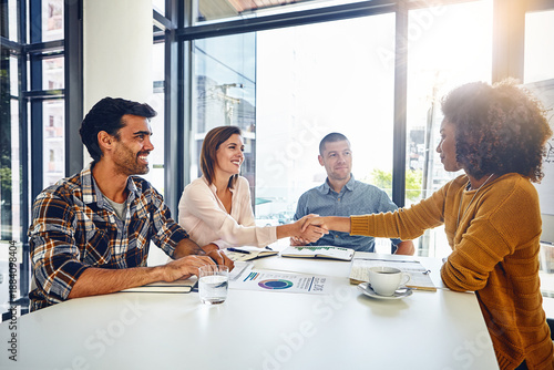 Tableau sur toile Boardroom, people and meeting with documents, handshake and happy for marketing manager recruitment