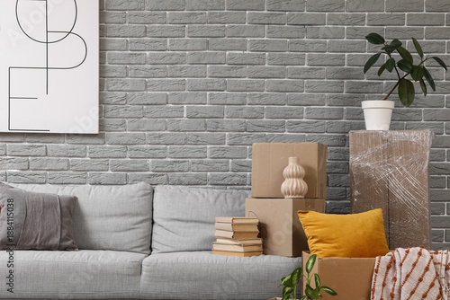 Sofa with cardboard boxes n...