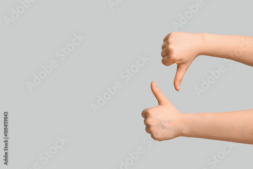 Female hands showing thumbs...