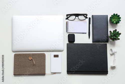 Laptop with earphones, note...