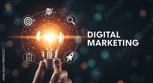 Hand holding glowing light bulb with digital marketing and text