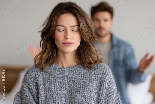 Caucasian young female calm amidst disagreement with caucasian adult male in casual setting