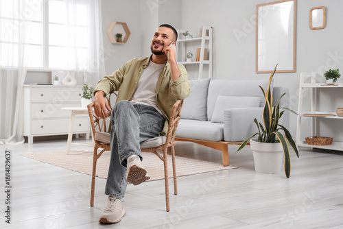 Handsome young man talking ...