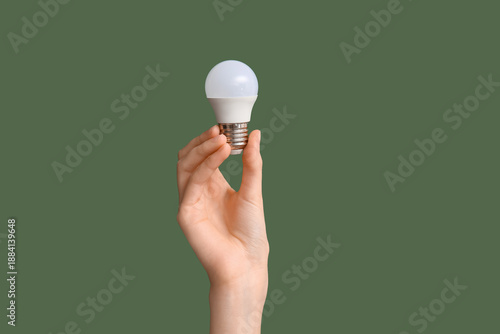 Female hand with light bulb...