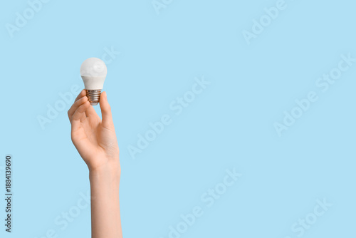 Female hand with light bulb...