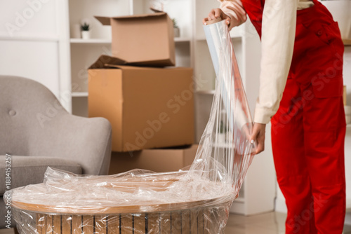 Female worker wrapping coff...
