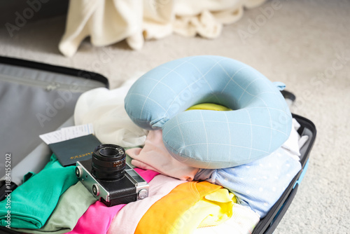 Open packed suitcase with n...