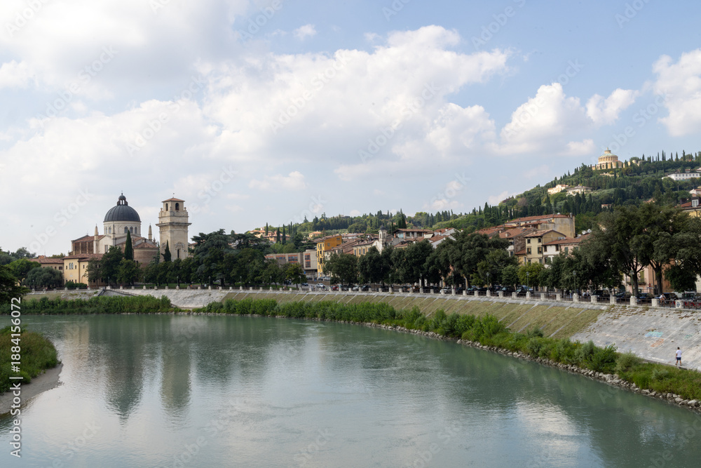 Fototapeta premium Photo of the beautiful city of Verona in Italy showing the town centre along side the river Adige in the summer time on a sunny day