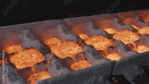 Molten pig iron pouring into ingot molds