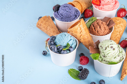 Colorful bright ice cream on bowls, with waffle cones