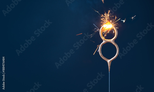 Obraz na płótnie 8 years celebration festive background with copy space made with Bengal fire in the form of number Eight