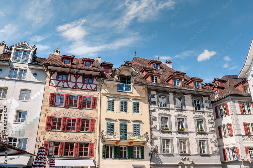 Fototapeta premium Lucerne, a compact Swiss city known for its well-preserved medieval architecture, is located amidst the snow-capped mountains of Lake Lucerne.