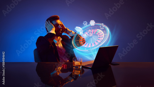 Slika na platnu Stressed businessman losing money during online roulette game at laptop