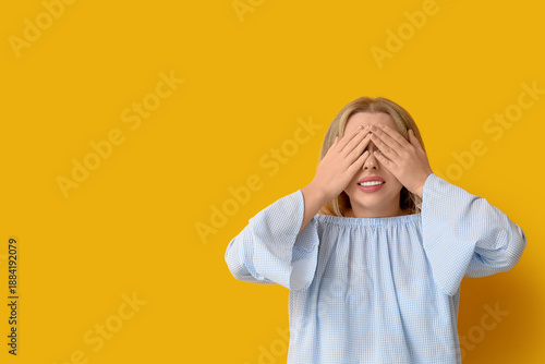 Embarrassed young woman on ...