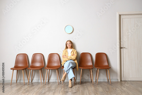 Mature woman waiting for her turn in room