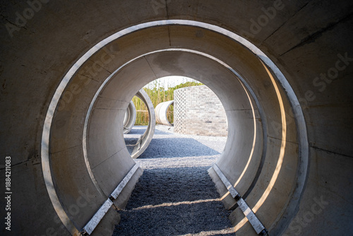 Concrete pipe tunnel perspective in a park - Industrial concept