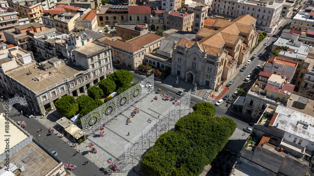 Fototapeta premium Aerial view of Reggio Calabria Cathedral, in Italy. It is a Roman Catholic cathedral in the historic center of the city. Its dedication is to the Assumption of the Virgin Mary. It is a sunny morning.