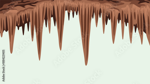 Dense group of pointed stalactites hanging from the dark ceiling of an ancient limestone cave for nature study.