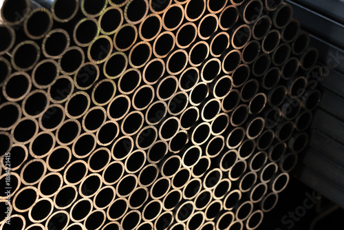 Tableau sur toile Close-up of stacked small diameter steel tubes forming a repeating circular patt