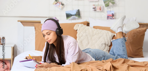 Teenage girl with headphone...