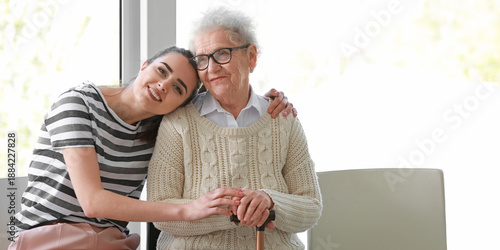Caregiver with senior woman...