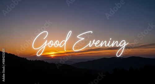 A serene mountain landscape at sunset with the words good evening overlayed in white cursive font across the center of the image