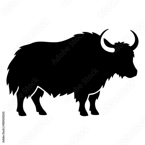 A majestic yak standing proudly in a serene mountainous landscape, viewed from the side.