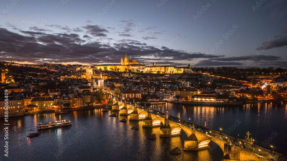 Αυτοκόλλητο The scene captures Prague Castle and Charles Bridge illuminated at night