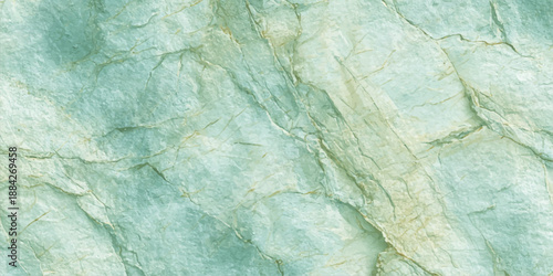 A blue marble stone wall texture with a rough grunge pattern on a light vintage paper surface creates a cold winter backdrop and artistic wallpaper design