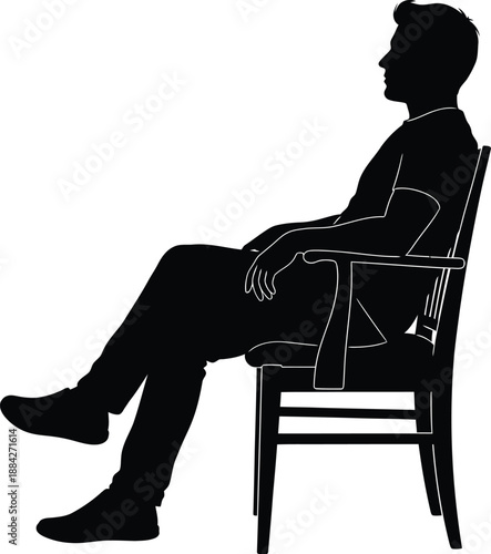 A man sitting on a chair in a relaxed position with his legs stretched out