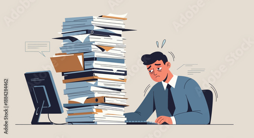 Man overwhelmed by paperwork sitting at desk with computer and tall stack of documents