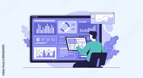 Analyst examining data visualizations on large computer screen and tablet device
