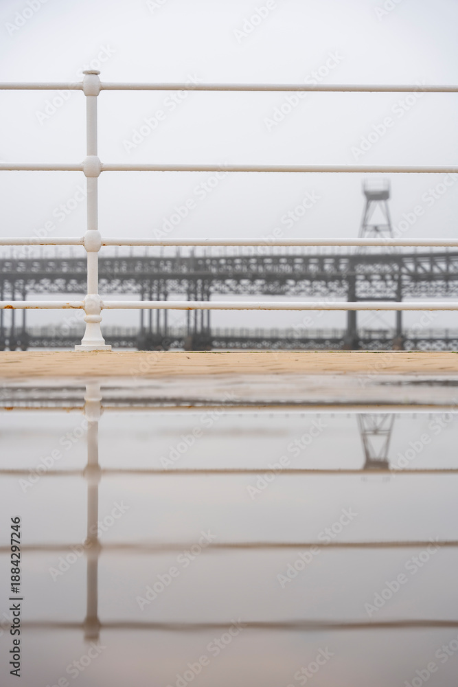 Fototapeta premium Huelva. Photo of the Tinto Wharf from the riverfront promenade. Very foggy winter day.